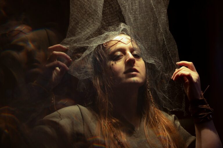 a woman with a veil over her head